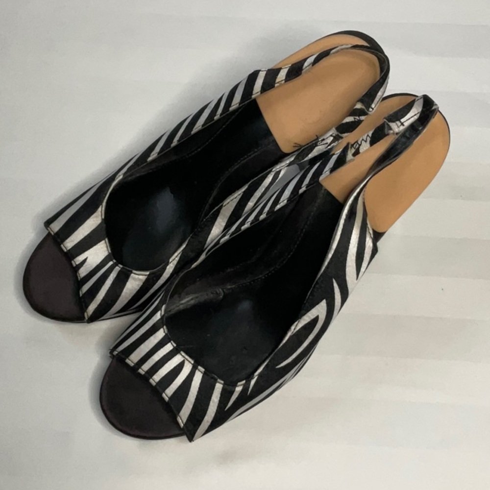 Unlisted “Born to spend” zebra stripe heels